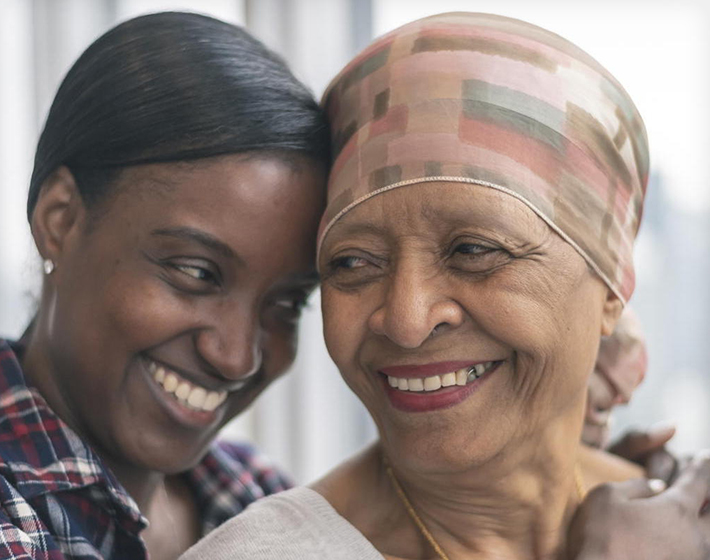 senior woman and daughter hug but need different messages