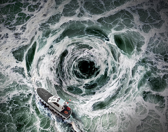 a small boat sails around an ocean whirlpool