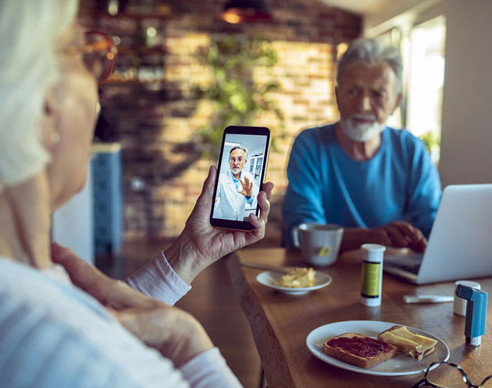 Baby boomer using technology to consult her doctor