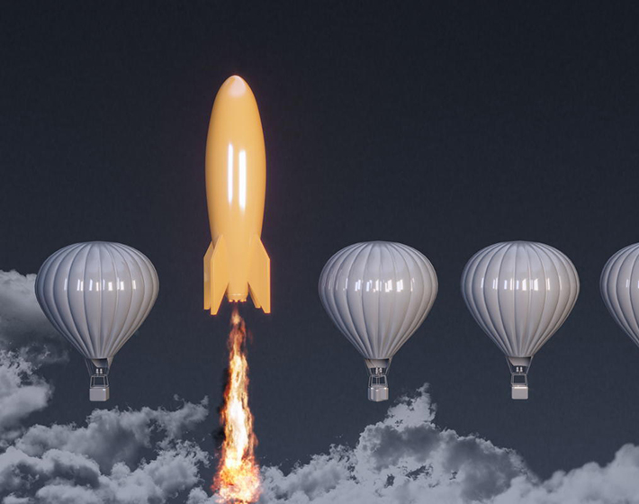 rocket ship takes off as hot air balloons hover as a metaphor for customization