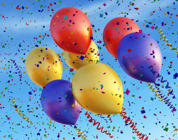 7 balloons fly through confetti in a blue sky to celebrate the 7th anniversary of sabal strategy