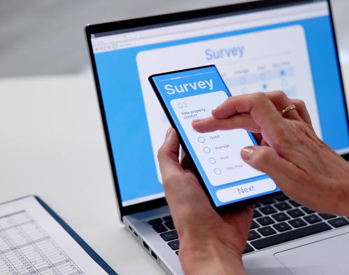 a lead-gen survey is filled out on a phone and appears on a laptop