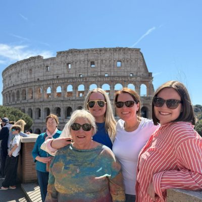 Four Jenkins women with the coliseum in the background.